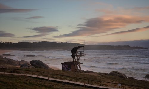 Lifeguard tower on the beach during the sunset in Corrubedo Natural Park in Spain A lifeguard tower on the beach during the sunset in Corrubedo Natural Park in Spain